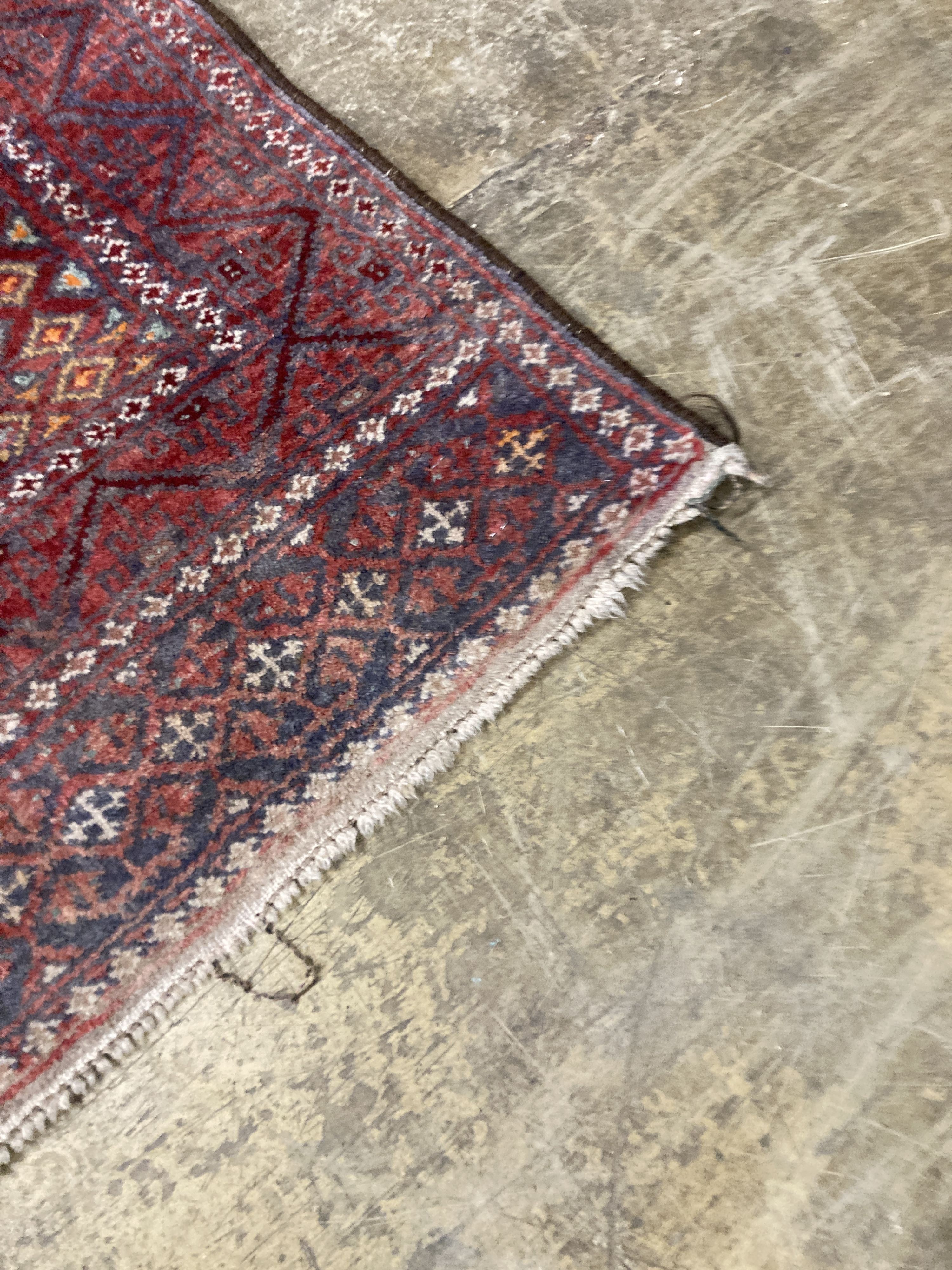 A Caucasian design red ground rug, 206 x 134cm together with a smaller West Persian design rug